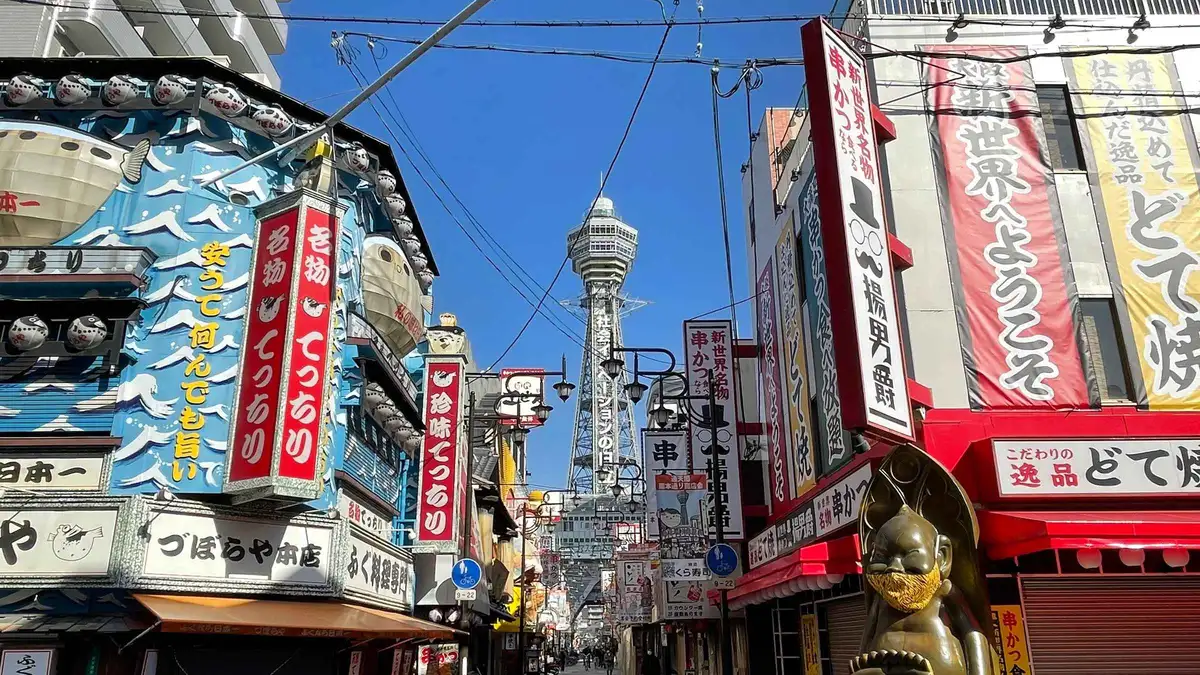 Tsutenkaku Tower lit above the Shinsekai streets on a Tsutenkaku Tower experience ticket, Osaka Japan