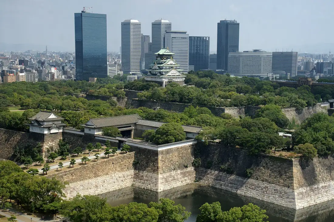 Osaka Castle's keep above its stone base seen across the inner moat, Osaka, Japan